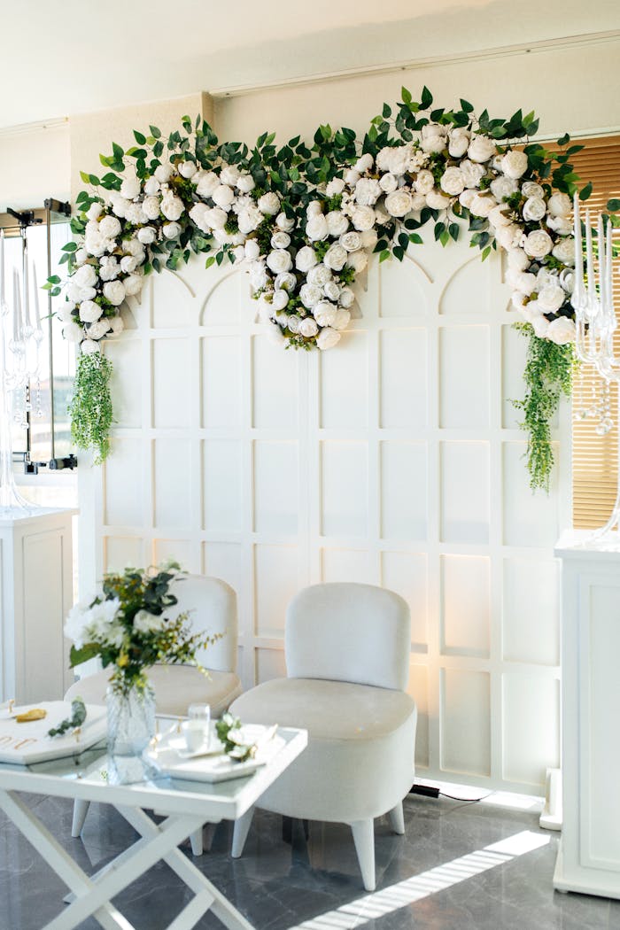 services-02 Chic wedding setup featuring lush floral arch and elegant seating for intimate gatherings.